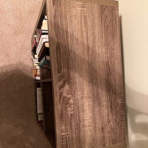 Grey four cubed bookshelf including four cubes and wooden wine/ glass rack.